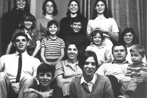 large family poses for black and white picture