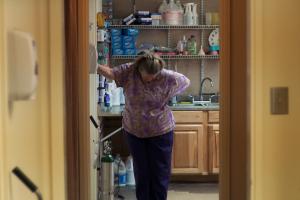 Kansas abortion doctor stands in office doorway looking down towards the ground