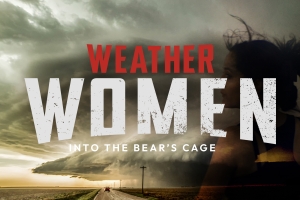 Dominated by a looming supercell thunderstorm over an open rural road, the image shows a lone vehicle driving straight into the heart of the storm. Bold, distressed white typography spells out “WOMEN,” anchored by a sharp red “WEATHER"